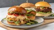 © Yuwadee - Three Gourmet Burgers with Unique Toppings and Sauces