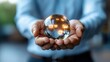 © Phirakhup - A person holding a crystal ball with glowing icons symbolizing digital technology.