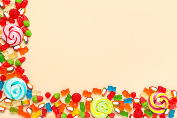 Canvas Print - Candies, jelly bears and lollipops on beige background