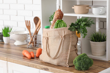 Wall Mural - Shopping bag with different fresh products on counter in kitchen