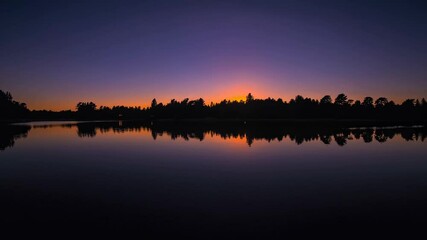 Poster - A serene lakeside panorama where a fiery orange sun meets the horizon, and a delicate comet streak illuminates the twilight sky.
