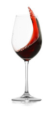 Red wine splashing in glass on white background