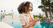 © peopleimages.com - Pool, vacation and woman with cellphone, travel and weekend break with influencer. People, summer holiday and girl with smartphone, hotel and social media with connection, texting and luxury resort