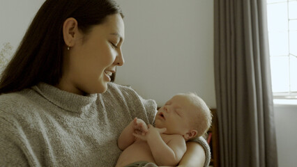 Sticker - Sleeping, smile and mom holding her baby in the bedroom of the modern family house together. Happy, care and young mother bonding with her infant, newborn or child with happiness in bedroom at home.