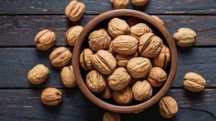 Poster - Wooden bowl overflowing with walnuts on dark rustic wooden background surrounded by scattered walnuts showcasing earthy tones and textures