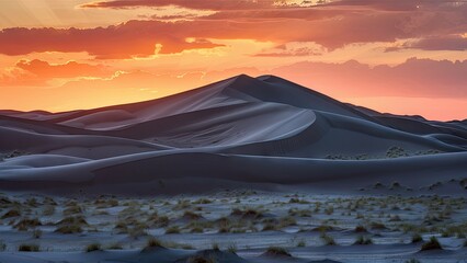 Poster - Vibrant sunset over vast desert dunes with soft sand formations in shades of orange and purple illuminated by warm evening light
