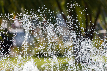 Wall Mural - A large spray of water is coming out of a fountain