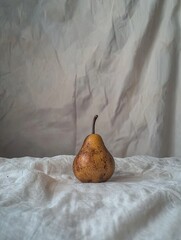 Poster - Ripe pear on fabric, minimalist still life, food photography, website blog