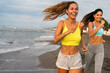 © NDABCREATIVITY - Portrait of a happy group of people exercising and doing sports and workout on the beach