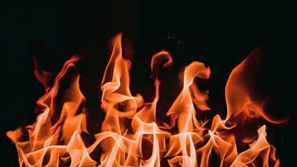 Poster - Vivid orange and yellow flames dancing upwards against a deep black background creating a striking contrast and dynamic visual interest.