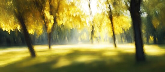 Poster - Vibrant blurred park scene with bright yellow autumn leaves and soft sunlight filtering through trees creating a serene and dreamy atmosphere