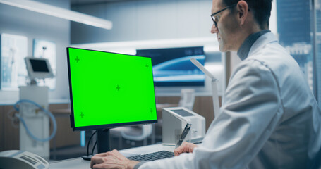 Aufkleber - A Male Scientist in a White Lab Coat Analyzes Data on a Green Screen Computer in a Advanced Medical Lab, Focusing on Advanced Healthcare Research and Technology in a High-tech Hospital Environment