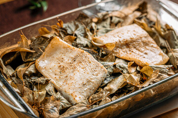 Wall Mural - Closeup on portion of baked white fish in a glass pan