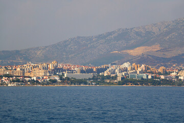 Wall Mural - Contemporary buildings, gardens and beaches at the waterfront in Split, Croatia. View of Split from the boat.