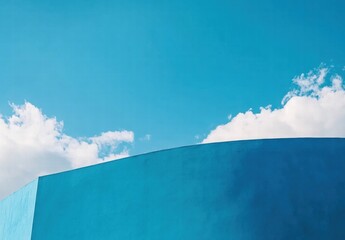 a blue wall with a blue sky in the background