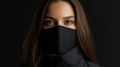© InspirationDesign - Young woman with black face mask in dark setting. Perfect for modern urban lifestyle, health protection and fashion portraiture.