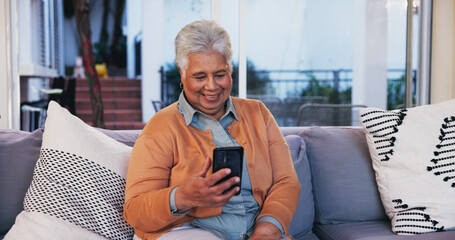 Canvas Print - House, typing and old woman on sofa, smartphone and internet with connection in lounge. Pensioner, happy and senior person on couch, mobile user and cellphone for texting, online chatting and contact