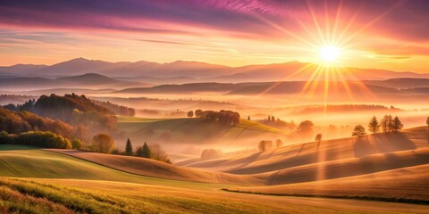 Canvas Print - Golden Sunrise Illuminates Rolling Hills and Misty Valley Landscape with Distant Mountain Range