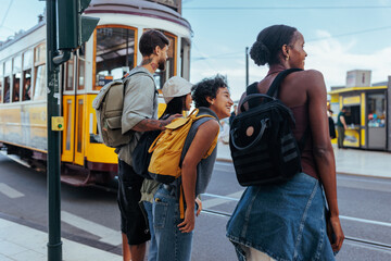 tourists waiting for a tram in lisbon, portugal