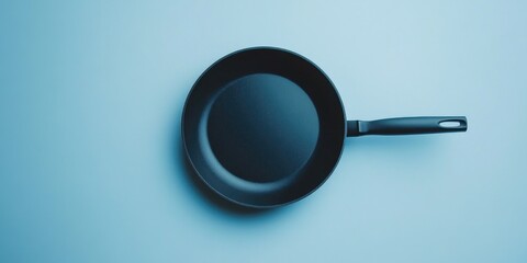 Poster - Black Frying Pan on Blue Surface