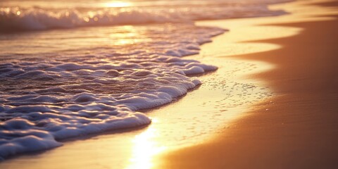 Wall Mural - Soft waves gently washing over a serene beach at sunset, creating a peaceful atmosphere.