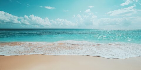 Wall Mural - a tranquil beach scene featuring turquoise waters and gentle waves under a clear sky.