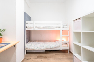 Bedroom with bunk beds in a modern and cozy apartment