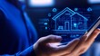 © chusnul - Person holding smartphone displaying digital blueprint of smart home technology with data overlay