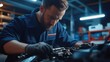 © Maju - Focused Mechanic Repairing a Car Engine