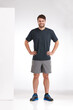 © peopleimages.com - Happy man, fitness or portrait with confidence for sport fashion, exercise or training on a white studio background. Male person, athlete or model with smile for active clothing style on mockup space