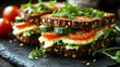 © Siasart Stock - Delicious Multigrain Sandwiches with Fresh Vegetables and Cheese on a Dark Background