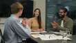© Yuliia - Team leader businesswoman CEO talk to colleagues coworkers discuss corporate business training group coaching in office happy diverse businessmen clients applauding successful presentation applause