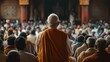 © jambulart - Elderly man faces a crowd within a structured building.