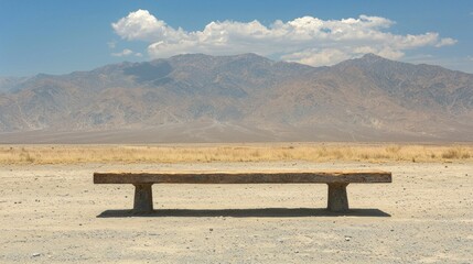 Poster - Wooden bench in desert landscape with mountains behind