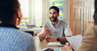 © WesLens/peopleimages.com - Businessman, intern and meeting with interview for hiring, recruitment or job opportunity at office. Man, employee or candidate with recruiting team, CV or resume for career, proposal or application