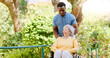 © peopleimages.com - Senior woman, nurse or walking with wheelchair for support or assisted living in outdoor garden. Happy, medical worker or assistant with old patient or person with disability for fresh air in nature