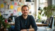 © sambath - A male entrepreneur working in a creative co-working space, surrounded by innovative projects and designs.