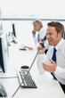 © peopleimages.com - Happy man, telephone and conversation in office, smile and speaking with client, happiness and info. Business people, employees and consultant in workplace, discussion and talking with computer