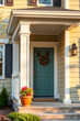 © MatandSterre - Charming Home Exterior: Teal Front Door, Autumn Wreath, and Inviting Porch.  Perfect for real estate listings and home design inspiration.