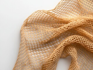 close up of a beige mesh fabric on a white background