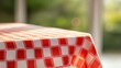 © Priya - red and white checkered tablecloth on a table outdoors
