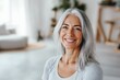 © id512 - smiling fit mature woman with gray hair in bright yoga studio, natural aging, healthy lifestyle