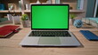 © stockbusters - Hand browsing website greenscreen laptop at home closeup zoom in. Unknown man