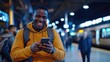 © Design By Reiga - Smiling man texting at night train station