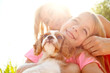 © peopleimages.com - Mother, girl and dog in nature after adoption, puppy care and bonding together with happiness. Flare, woman and child with pet animal for companion, share moment and connection by mockup space