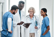 © peopleimages.com - Discussion, meeting and doctor with tablet for online patient report, results review and diagnosis. Healthcare, medical people and team communication in hospital, clinic or health facility schedule