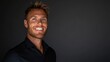 © Konstiantyn Zap - Smiling caucasian male adult with blond hair against dark background