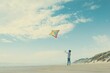© Hunman - Low-angle shot of a child flying a colorful kite on a windy beach, with plenty of sky above. Copyspace.