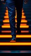 © Preeyanuch - A businessman confidently walks down illuminated steps, symbolizing progress and determination in a modern environment.