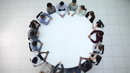 Wall Mural - acquaintance of employees in the conference room sitting at the table